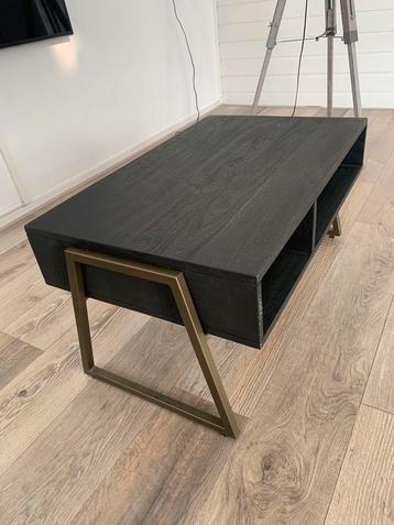 Zwarte salontafel met gouden poten beschikbaar voor biedingen