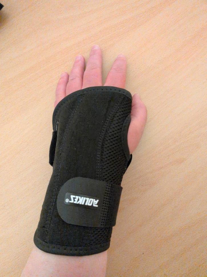 Korte Aolikes Polsbrace  links, Diversen, Braces, Nieuw, Ophalen of Verzenden