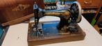 Antieke Singer naaimachine, Ophalen