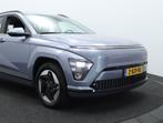 Hyundai Kona Electric Comfort 65.4 kWh | Navigatie | Camera, 750 kg, Met garantie (alle), Blauw, Grijs