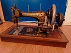 Antieke naaimachine, Ophalen