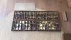 4 letterbakken met loden letters, Ophalen