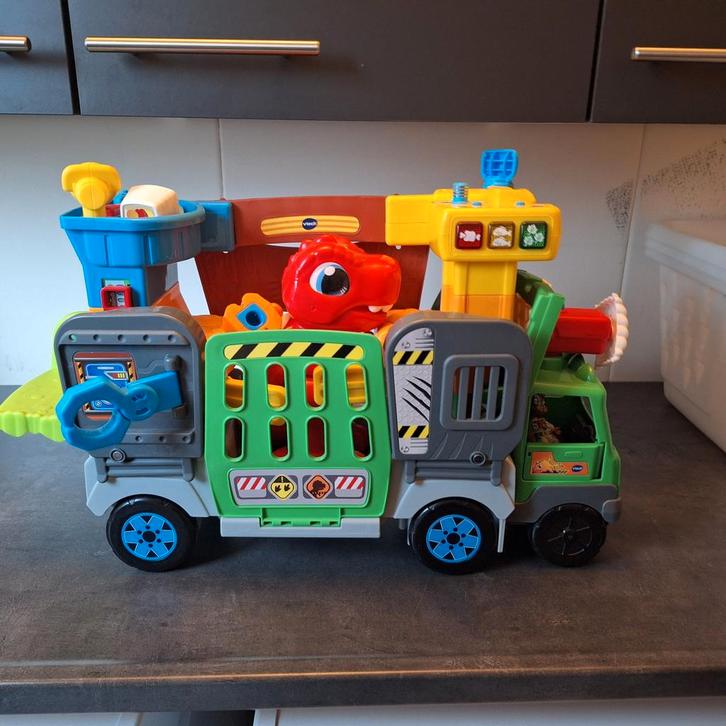 V tech vrolijke vriendjes Dino parkauto, Kinderen en Baby's, Speelgoed | Vtech, Zo goed als nieuw, Ophalen