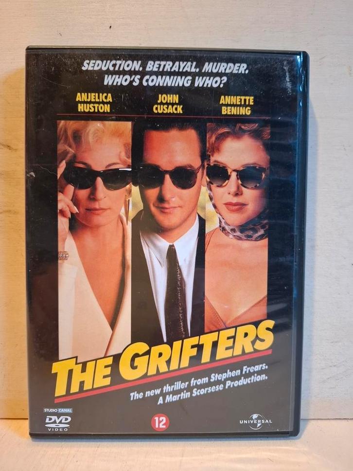 The Grifters
(1990) John Cusack ‧ Crime/Thriller ‧ DVD, Cd's en Dvd's, Dvd's | Thrillers en Misdaad, Zo goed als nieuw, Maffia en Misdaad