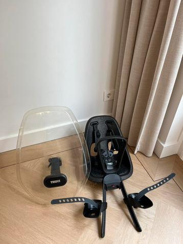 Fietsstoeltje Thule en windscherm beschikbaar voor biedingen