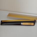 Briefopener in sleuf met lineaal, Verzenden