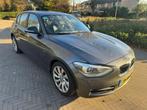 BMW 1-Serie 116i Upgrade Edition Automaat Leer Xenon 5 Deurs, 65 €/maand, Zwart, 4 cilinders, 650 kg