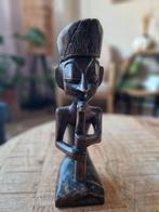Afrikaans houten beeldje, Ophalen