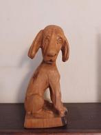 Houten beeldje van een hond, Ophalen