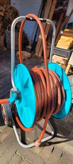 Tuinslang op haspel met wieltjes Gardena, Tuin en Terras, Tuinslangen, Ophalen of Verzenden, Gebruikt, Tuinslang