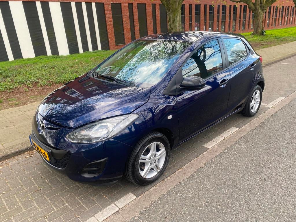 Mazda 2 1.3 BIFUEL Cool EXPORT PRIJS, Auto's, Mazda, Voorwielaandrijving, Euro 5, Stof, Gebruikt