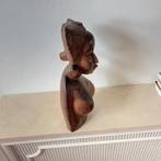 Houten Afrikaans beeld, Ophalen