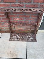 Gietijzeren laarzenrek, Ophalen