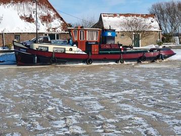 Sleepboot met industrie motor.