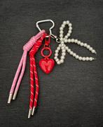 Lovergirl Bag Charm sleutelhanger be golden - strik hartje, Verzamelen, Ophalen of Verzenden, Nieuw