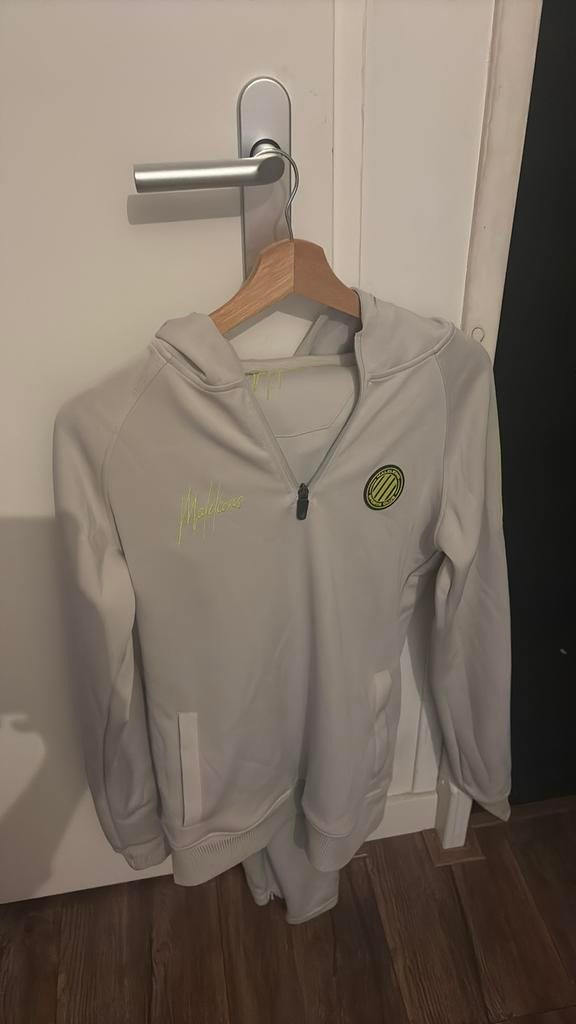 Trainingspak malelions, Ophalen of Verzenden, Zo goed als nieuw, Zwart