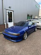 Toyota Celica 1.6 ST LB 1986 Wit, Auto's, Toyota, Voorwielaandrijving, Zwart, 4 cilinders, Blauw