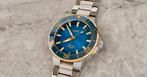 Oris Aquis cal 400 staal/goud met nog 8 jaar Oris Garantie., Sieraden, Tassen en Uiterlijk, Horloges | Heren, Overige merken, Staal