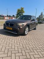 BMW X1 2.0 D Sdrive 18D AUT 2011 Bruin, Auto's, Euro 5, Achterwielaandrijving, Bruin, Origineel Nederlands