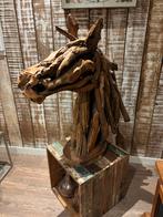 Houten paarden kop, Ophalen