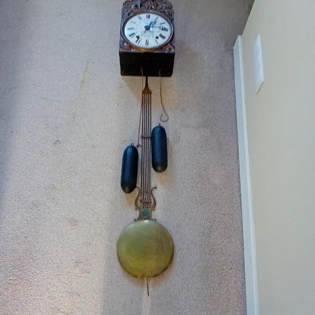 antieke wandklok, Ophalen