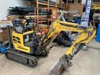 Goedwerkende mini kraan New Holland, Ophalen, Graafmachine