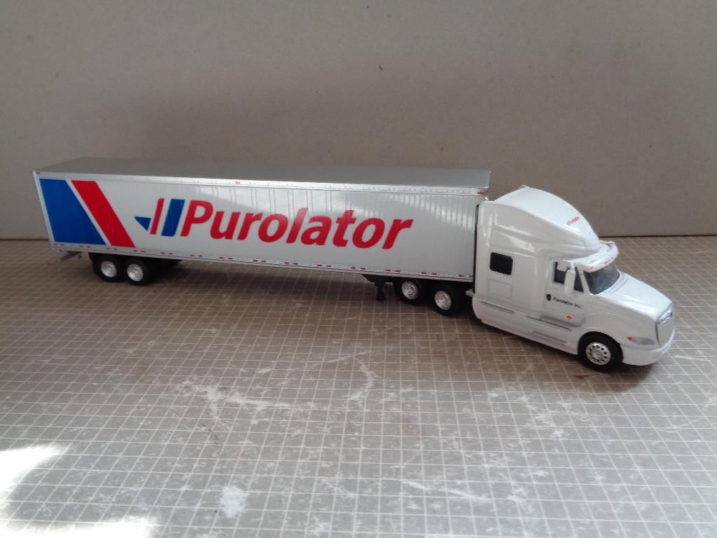 usa truck met dichte trailer purolator, Ophalen of Verzenden, Zo goed als nieuw, Bus of Vrachtwagen, Rietze