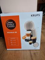 Met de bon aanwezig.K rups NESCAFÉ DOLCE GUSTO PICCOLO XS, Witgoed en Apparatuur, Koffiezetapparaten, Ophalen of Verzenden, Nieuw