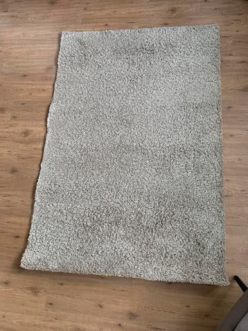 Beige vloerkleed beschikbaar voor biedingen
