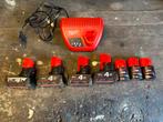 Milwaukee m12 7x accu + lader, Ophalen of Verzenden, Boormachine