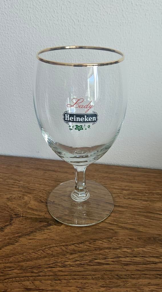 20 x Heineken Lady glas. Nieuw in doos, maar 50 jaar oud, Ophalen of Verzenden, Zo goed als nieuw, Glas of Glazen, Heineken