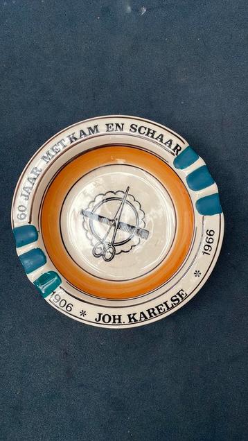 Reclame asbak 60 jaar met kam en schaar john Karelse beschikbaar voor biedingen