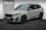 BMW iX1 eDrive20 M Sport | Trekhaak / Panoramadak / Harman K, Stof, Met garantie (alle), Wit, 204 pk