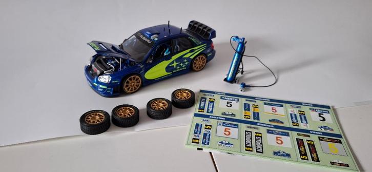 Subaru Impreza WRC 2005 World Rally Team., Hobby en Vrije tijd, Modelauto's | 1:24, Zo goed als nieuw, Auto, Overige merken, Ophalen of Verzenden