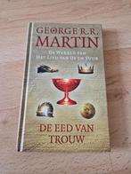 Boek george r r martin de eed van trouw ijs vuur wereld, Boeken, Ophalen of Verzenden, Zo goed als nieuw