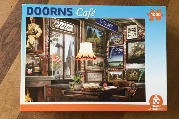 Puzzel Doorns Café - House of Holland, 1000 stukjes, Hobby en Vrije tijd, Denksport en Puzzels, Zo goed als nieuw, Legpuzzel, 500 t/m 1500 stukjes