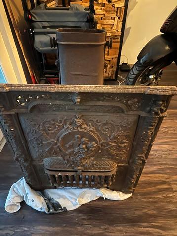 Antiek Gietijzeren Kachelfront beschikbaar voor biedingen