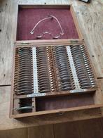 Antieke opticien brillendoos met diverse lenzen, Ophalen of Verzenden