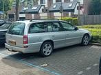 Opel Omega 2.2 I 16V St.wgn. 2001 Grijs, Auto's, Omega, 4 cilinders, 1650 kg, Stationwagon