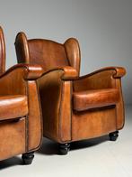 Set van 2 schapenleren fauteuils
