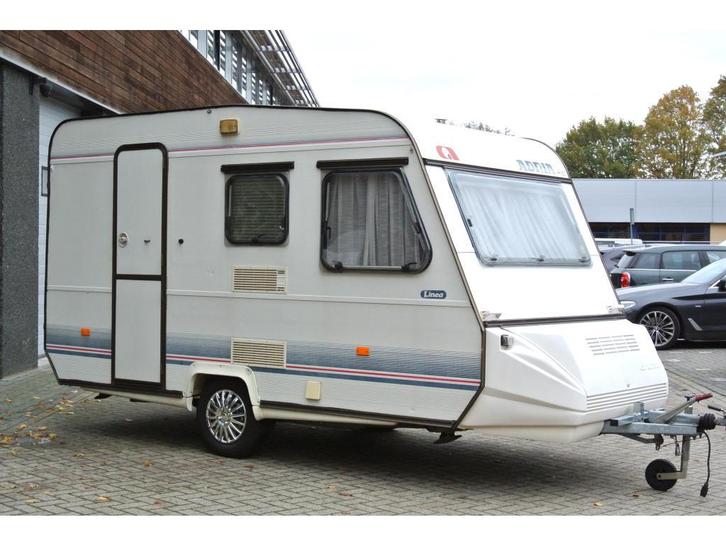 Adria Linea 400 TK|Stapelbed|Voortent|, Caravans en Kamperen, Caravans, Bedrijf, 500 - 750 kg, Standaardzit, Adria, Dwarsbed, Dwars-stapelbed