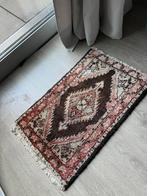 Perzisch tapijt deurmat, Ophalen