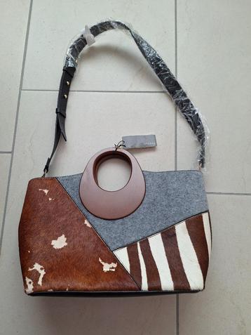 leren schoudertas koeienhuid beschikbaar voor biedingen