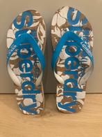 Superdry slippers met bloemenprint - Maat 42, Ophalen of Verzenden, Gedragen, Blauw, Slippers