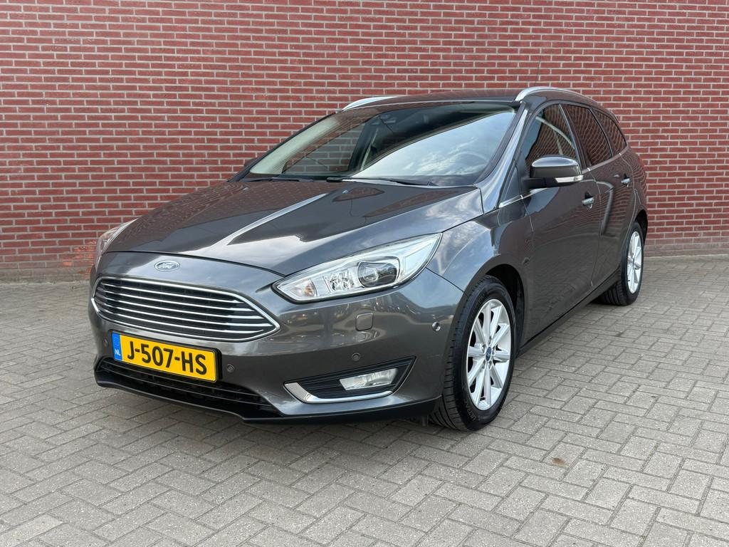 Ford Focus Wagon 1.0 Titanium Edition / Airco / Cruise / PDC, 125 pk, Gebruikt, Euro 6, Leder en Stof