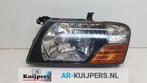 Koplamp links van een Mitsubishi Pajero (Pajero 00-), 3 maanden garantie, Gebruikt, Mitsubishi