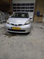 Toyota Aygo 1.0 12V Vvt-i 5DRS 2007 Grijs, Auto's, Voorwielaandrijving, Stof, Zwart, 4 stoelen