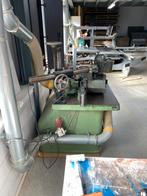 Stationaire freesmachine met doorvoerapparaat, Ophalen