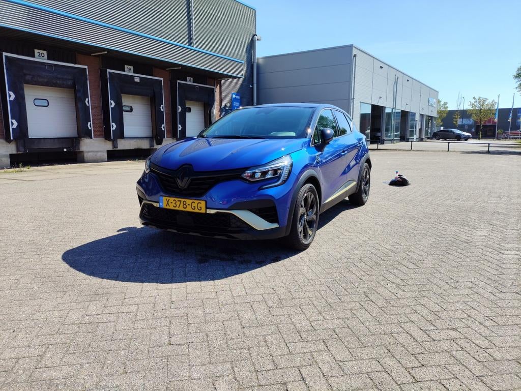 Renault Captur E-tech Hybrid 145pk Aut 2023 Blauw, Auto's, Renault, Stof, 4 cilinders, 715 kg, Blauw