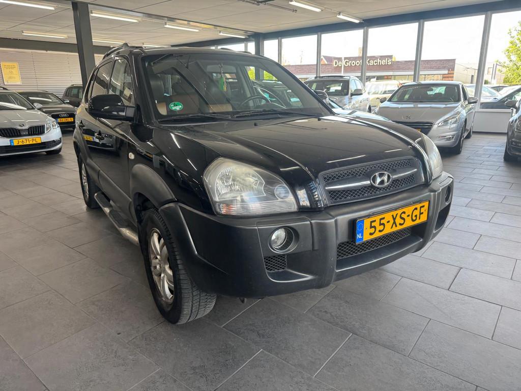Hyundai Tucson 2.0i Style Premium LPG g3 leer clima cruise c, Auto's, 4 cilinders, Startonderbreker, Zwart, Handgeschakeld